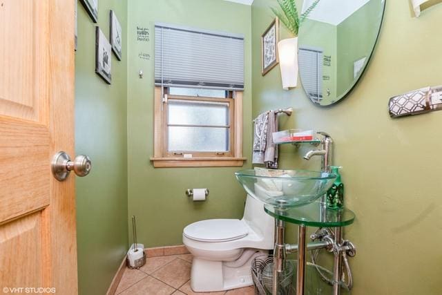 2535 W 116th Pl, Chicago, IL 60655 - half bathroom featuring tile patterned floors, toilet, baseboards, and a sink