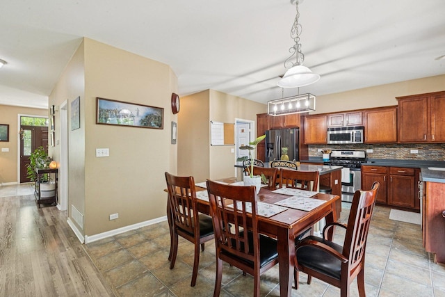 1885 W Greenleaf Ct, Round Lake, IL 60073 - dining area featuring baseboards