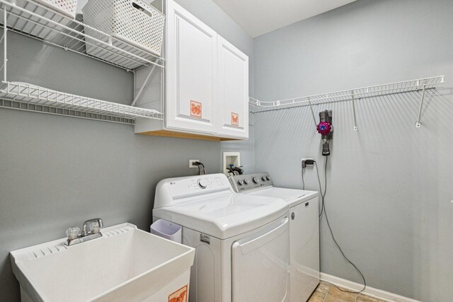 1885 W Greenleaf Ct, Round Lake, IL 60073 - washroom featuring washer and clothes dryer, cabinet space, and baseboards