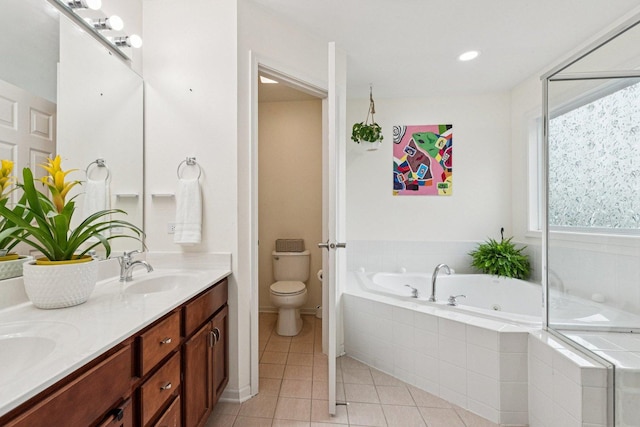 1885 W Greenleaf Ct, Round Lake, IL 60073 - full bathroom with double vanity, a whirlpool tub, toilet, tile patterned floors, and baseboards