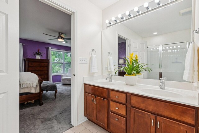 1885 W Greenleaf Ct, Round Lake, IL 60073 - bathroom with double vanity, ensuite bathroom, a shower stall, ceiling fan, and tile patterned flooring