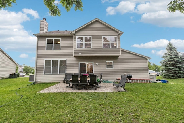 1885 W Greenleaf Ct, Round Lake, IL 60073 - rear view of house with a patio area, a yard, and a chimney