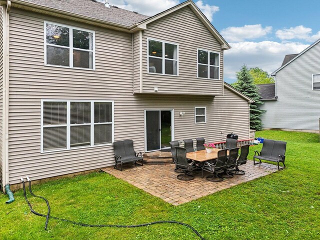 1885 W Greenleaf Ct, Round Lake, IL 60073 - rear view of house featuring a patio area, a lawn, and entry steps