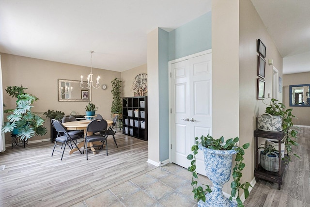 1885 W Greenleaf Ct, Round Lake, IL 60073 - dining room featuring baseboards, a chandelier, and light wood-style floors