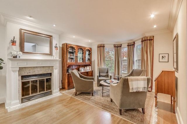 2722 N Bosworth Ave, Chicago, IL 60614 - living area with crown molding, wood finished floors, a premium fireplace, recessed lighting, and baseboards