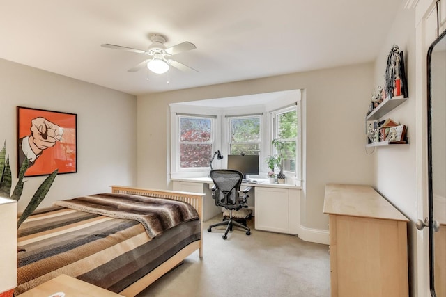 2722 N Bosworth Ave, Chicago, IL 60614 - bedroom with light carpet, an office area, and a ceiling fan