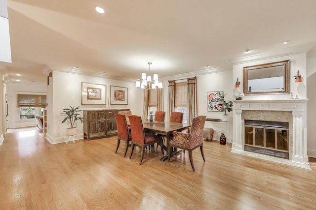 2722 N Bosworth Ave, Chicago, IL 60614 - dining room featuring crown molding, a chandelier, light wood-style floors, a premium fireplace, and recessed lighting