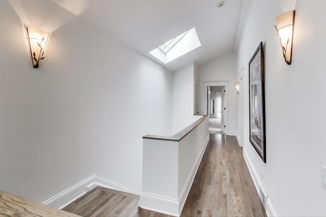 2722 N Bosworth Ave, Chicago, IL 60614 - hall with a skylight, vaulted ceiling, wood finished floors, baseboards, and an upstairs landing