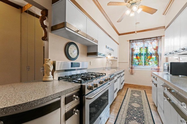 3530 N Lake Shore Dr Unit 12B, Chicago, IL 60657 - kitchen with stainless steel gas range oven, white cabinets, light wood finished floors, crown molding, and a ceiling fan