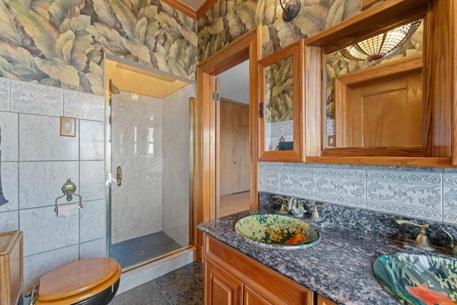 3530 N Lake Shore Dr Unit 12B, Chicago, IL 60657 - bathroom featuring a shower stall, vanity, tasteful backsplash, toilet, and ornamental molding