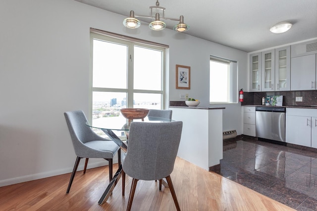 1212 N La Salle Dr Unit 2309, Chicago, IL 60610 - dining area with baseboards and a baseboard radiator
