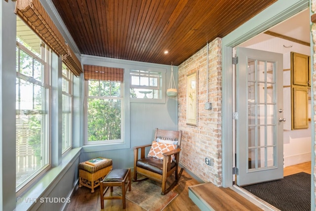 3726 Kenilworth Ave, Berwyn, IL 60402 - sunroom with wood ceiling, wood finished floors, and brick wall