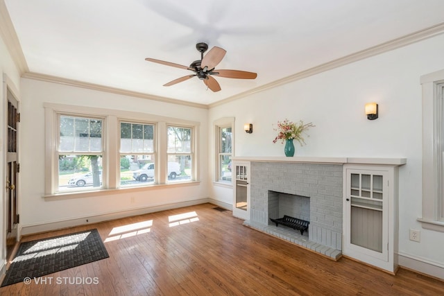 3726 Kenilworth Ave, Berwyn, IL 60402 - unfurnished living room with wood-type flooring, a ceiling fan, crown molding, baseboards, and a fireplace