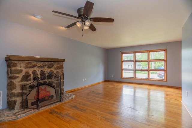 1326 N Harrison St, Algonquin, IL 60102 - unfurnished living room featuring a ceiling fan, wood finished floors, baseboards, and a fireplace