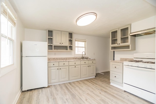 1326 N Harrison St, Algonquin, IL 60102 - kitchen with white appliances, a sink, open shelves, light wood finished floors, and baseboards