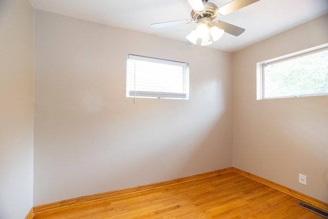 1326 N Harrison St, Algonquin, IL 60102 - unfurnished room with light wood-style floors, ceiling fan, and baseboards