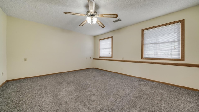 305 S Prairie Ave, Polo, IL 61064 - carpeted empty room with baseboards, ceiling fan, and a textured ceiling