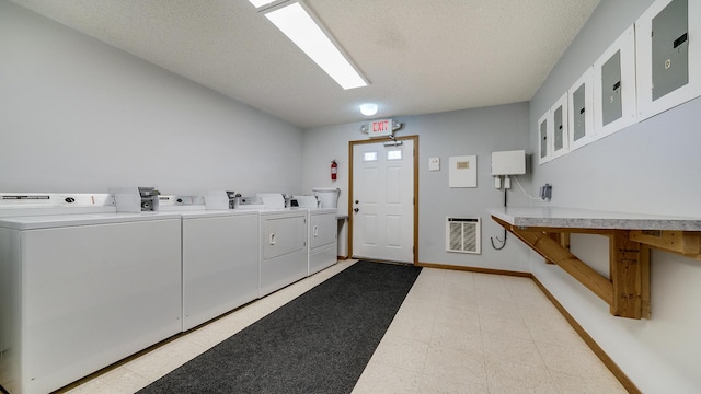 305 S Prairie Ave, Polo, IL 61064 - shared laundry featuring washing machine and dryer, heating unit, a textured ceiling, baseboards, and light flooring