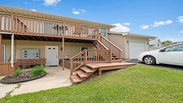 305 S Prairie Ave, Polo, IL 61064 - view of front of house featuring driveway, a front yard, a garage, a wooden deck, and stairs