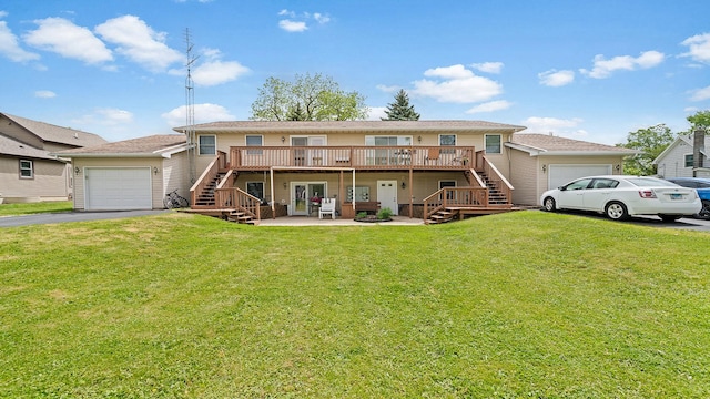 305 S Prairie Ave, Polo, IL 61064 - view of property with stairway, a deck, a garage, and driveway