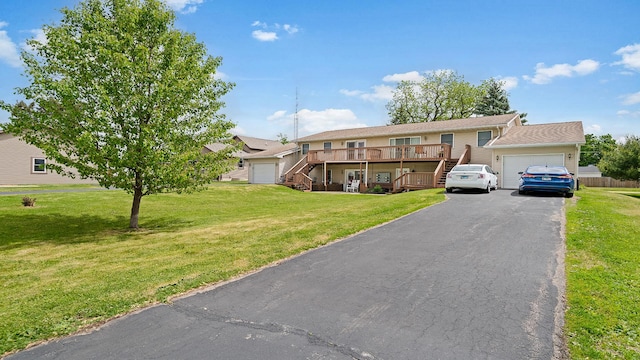 305 S Prairie Ave, Polo, IL 61064 - view of property with stairway, asphalt driveway, an attached garage, and a front lawn
