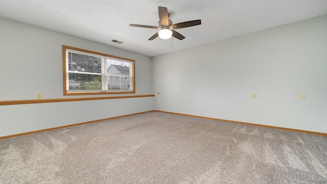 305 S Prairie Ave, Polo, IL 61064 - carpeted empty room with baseboards, a ceiling fan, and a textured ceiling