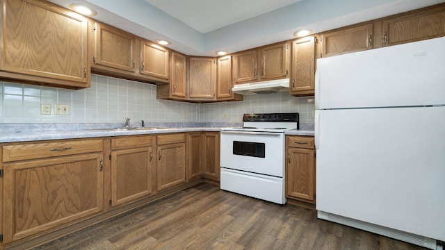 305 S Prairie Ave, Polo, IL 61064 - kitchen with white appliances, under cabinet range hood, a sink, light countertops, and backsplash