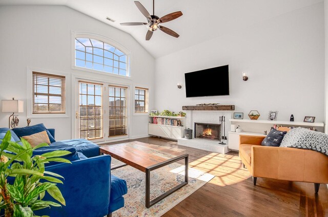 930 W Cuyler Ave Unit 3W, Chicago, IL 60613 - living area with wood finished floors, a brick fireplace, ceiling fan, and high vaulted ceiling