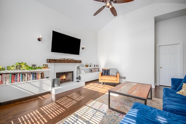 930 W Cuyler Ave Unit 3W, Chicago, IL 60613 - living area with a brick fireplace, ceiling fan, wood finished floors, and high vaulted ceiling