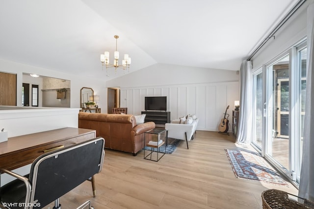 204 Barnwood Trl, Mchenry, IL 60050 - living area with a chandelier, light wood finished floors, vaulted ceiling, and a decorative wall