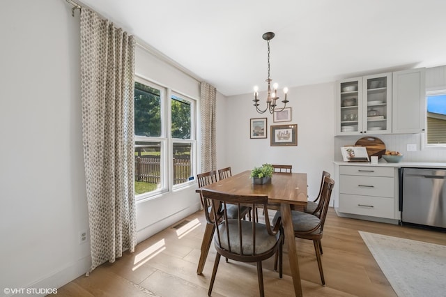 204 Barnwood Trl, Mchenry, IL 60050 - dining room with a chandelier and light wood-style floors