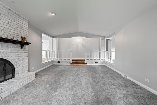 15285 State St, South Holland, IL 60473 - unfurnished living room featuring vaulted ceiling, carpet flooring, a fireplace, and baseboards