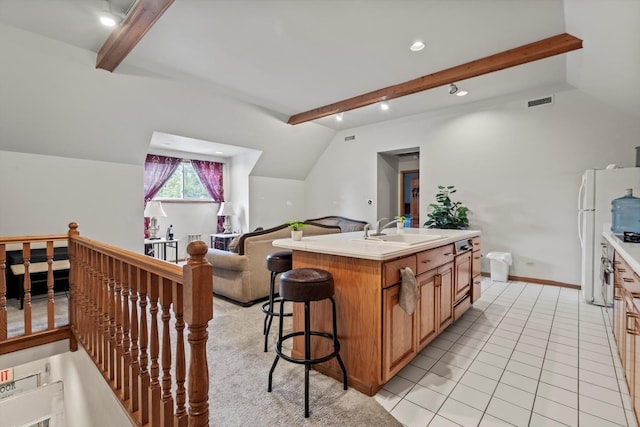 15285 State St, South Holland, IL 60473 - kitchen featuring a sink, open floor plan, a kitchen island with sink, light countertops, and freestanding refrigerator