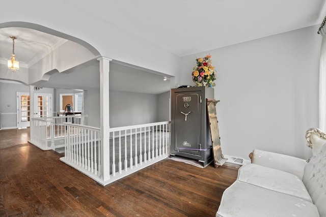 15285 State St, South Holland, IL 60473 - living area with wood finished floors, arched walkways, an upstairs landing, and baseboards