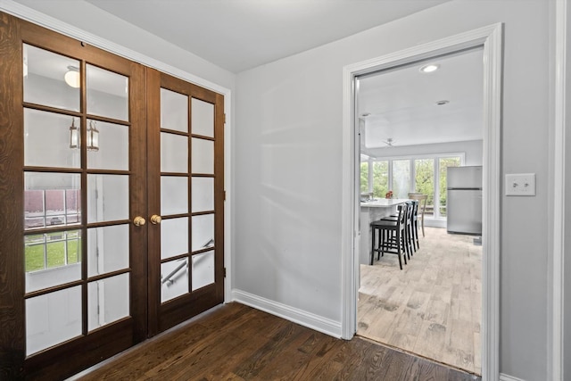 15285 State St, South Holland, IL 60473 - doorway with french doors, dark wood-style floors, and baseboards