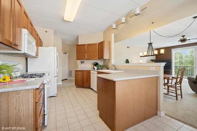 541 N Hough St Unit 205, Barrington, IL 60010 - kitchen featuring white appliances, a peninsula, light tile patterned floors, hanging light fixtures, and brown cabinetry