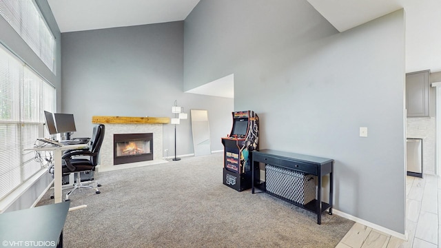 412 Joshua Tree, Harvard, IL 60033 - carpeted office featuring a towering ceiling, a fireplace with flush hearth, and baseboards