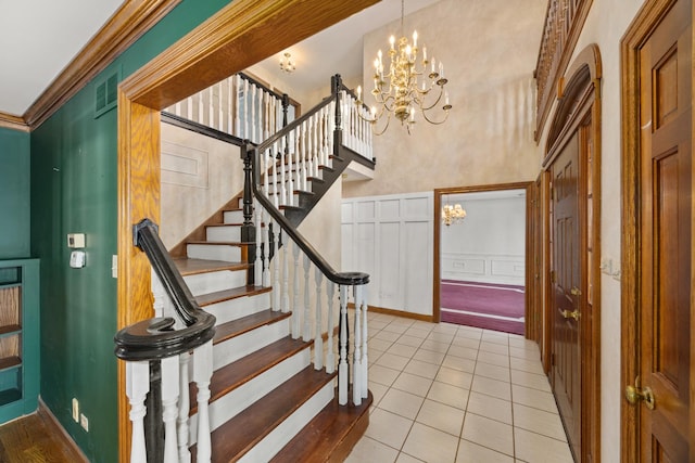 14301 Wooded Path Ln, Orland Park, IL 60462 - foyer entrance featuring a decorative wall, a chandelier, stairs, light tile patterned flooring, and a wainscoted wall