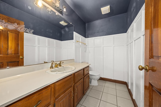 14301 Wooded Path Ln, Orland Park, IL 60462 - bathroom featuring vanity, tile patterned flooring, toilet, and a decorative wall