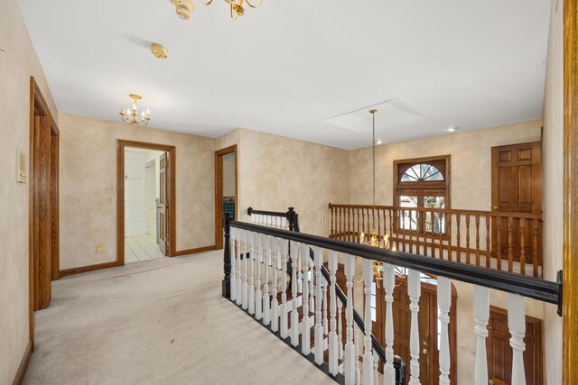 14301 Wooded Path Ln, Orland Park, IL 60462 - hall with a chandelier, carpet, baseboards, and an upstairs landing