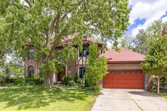 14301 Wooded Path Ln, Orland Park, IL 60462 - view of front facade with brick siding, driveway, a front lawn, and a garage