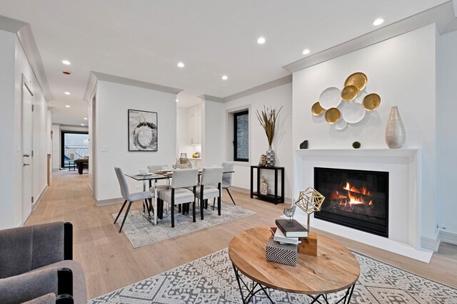 1646 N Orchard St Unit 1N, Chicago, IL 60614 - dining space featuring light wood-style flooring, recessed lighting, a glass covered fireplace, and baseboards