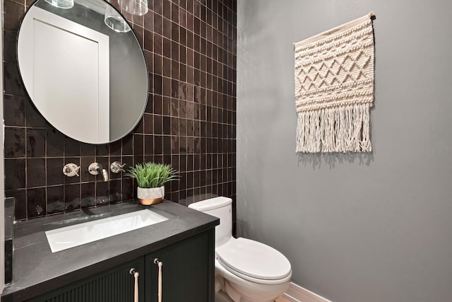 1646 N Orchard St Unit 1N, Chicago, IL 60614 - half bath with vanity, toilet, tasteful backsplash, baseboards, and tile walls