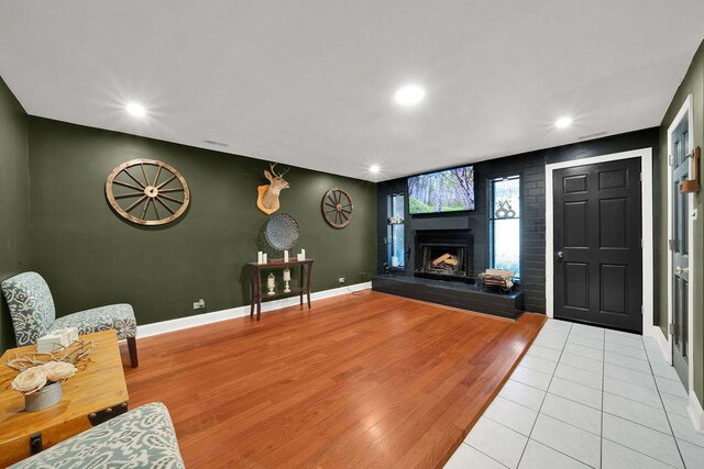 5640 W 82nd Pl, Burbank, IL 60459 - living area featuring a fireplace with raised hearth, light wood finished floors, recessed lighting, an accent wall, and baseboards