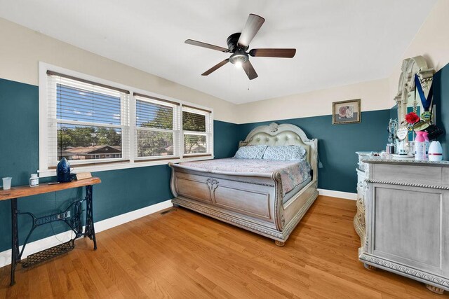 5640 W 82nd Pl, Burbank, IL 60459 - bedroom with multiple windows, light wood-style floors, baseboards, and ceiling fan