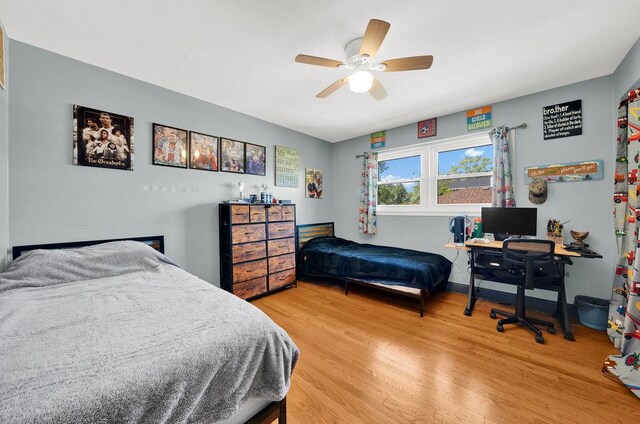 5640 W 82nd Pl, Burbank, IL 60459 - bedroom featuring light wood finished floors and a ceiling fan