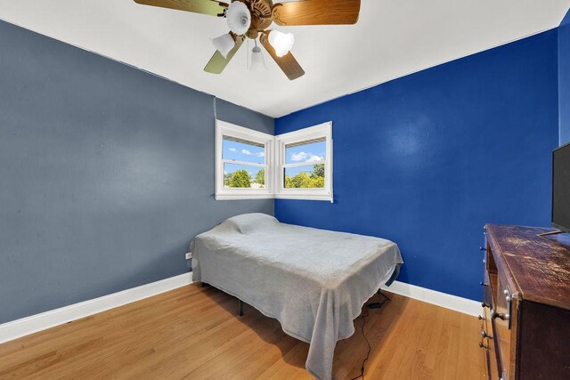 5640 W 82nd Pl, Burbank, IL 60459 - bedroom with wood finished floors, baseboards, and ceiling fan
