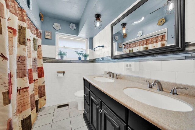 5640 W 82nd Pl, Burbank, IL 60459 - bathroom featuring tile walls, tile patterned flooring, double vanity, toilet, and a shower with shower curtain
