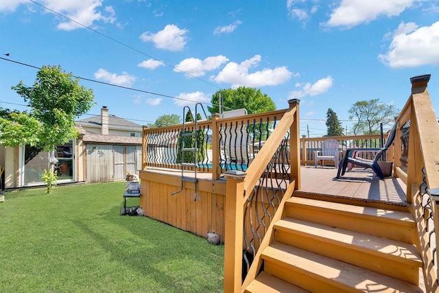 5640 W 82nd Pl, Burbank, IL 60459 - deck featuring a jacuzzi, a lawn, and an outbuilding