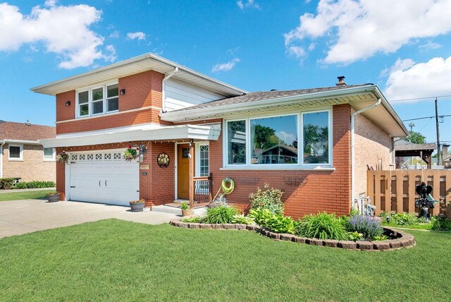 5640 W 82nd Pl, Burbank, IL 60459 - split level home with brick siding, a garage, and driveway